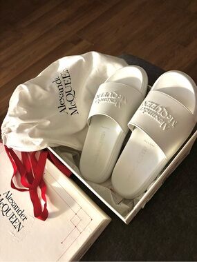 Alexander McQueen White Logo Embossed Slide Sandals.